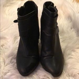 Black zip up ankle booties with strap detail